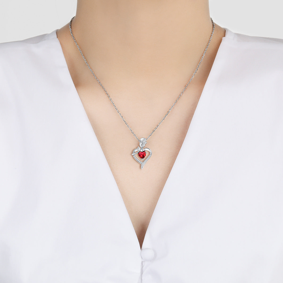 Collier en forme de cœur avec strass, motif fleur éternelle, idéal pour la Saint-Valentin.